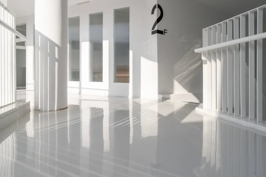 High-gloss urethane coated floor in a modern commercial stairwell