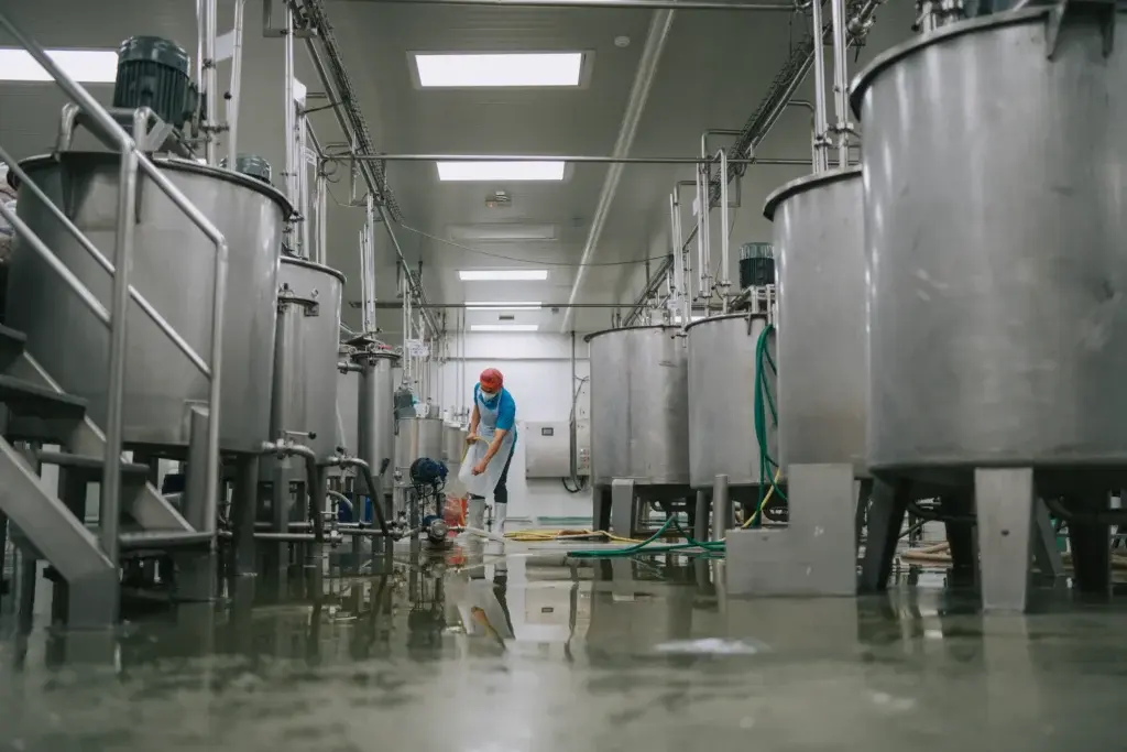 Surfaces supporting Industrial food processing equipment can be protected with antimicrobial coatings for durability during frequent washdowns.